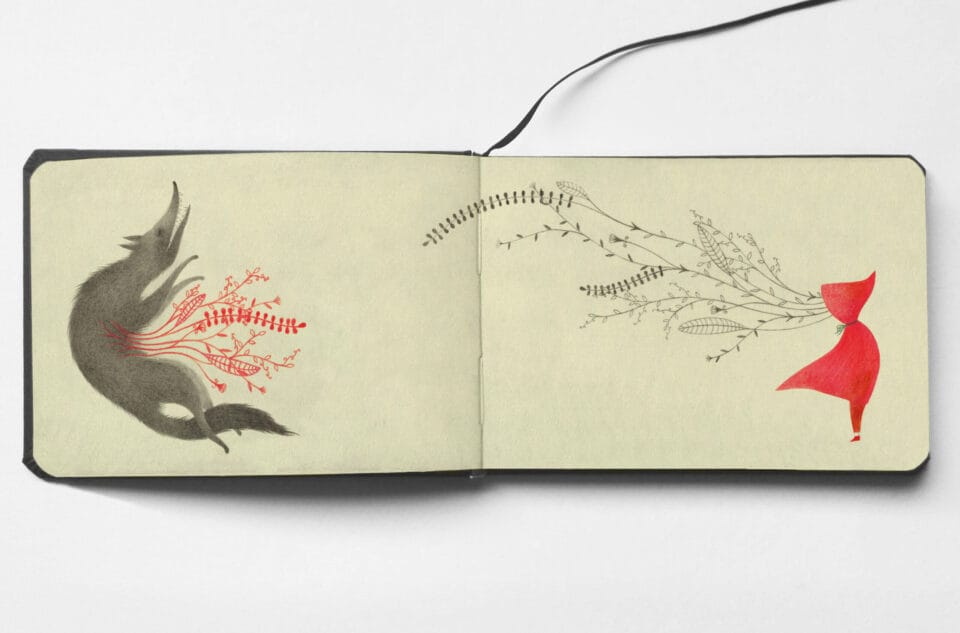 an open sketchbook showing red plants growing from a wolf on the left and gray plants growing from a red-hooded figure on the right